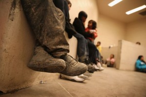 MCALLEN, TX - SEPTEMBER 08:  Women and children sit in a holding cell at a U.S. Border Patrol processing center after being detained by agents near the U.S.-Mexico border on September 8, 2014 near McAllen, Texas. Thousands of immigrants, many of them families and unaccompanied minors, continue to cross illegally into the United States, although the numbers are down from a springtime high. Texas' Rio Grande Valley area is the busiest sector for illegal border crossings into the United States.  (Photo by John Moore/Getty Images) ** OUTS - ELSENT, FPG - OUTS * NM, PH, VA if sourced by CT, LA or MoD **